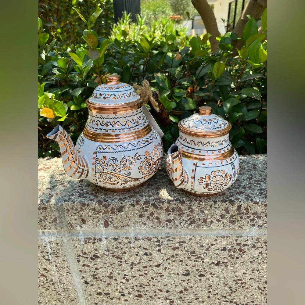 This handmade, white-painted Turkish copper teapot set features traditional